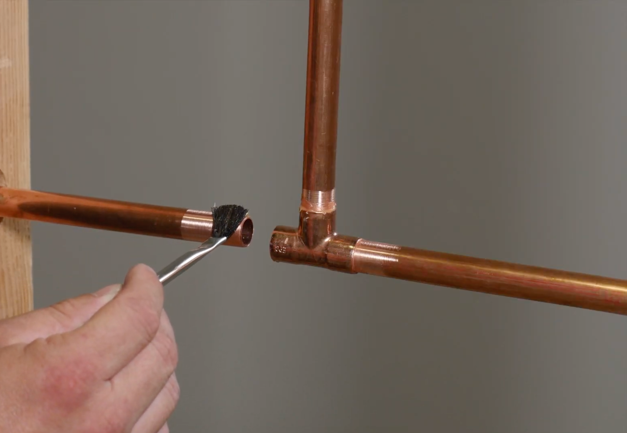 Applying Flux to Copper Pipe