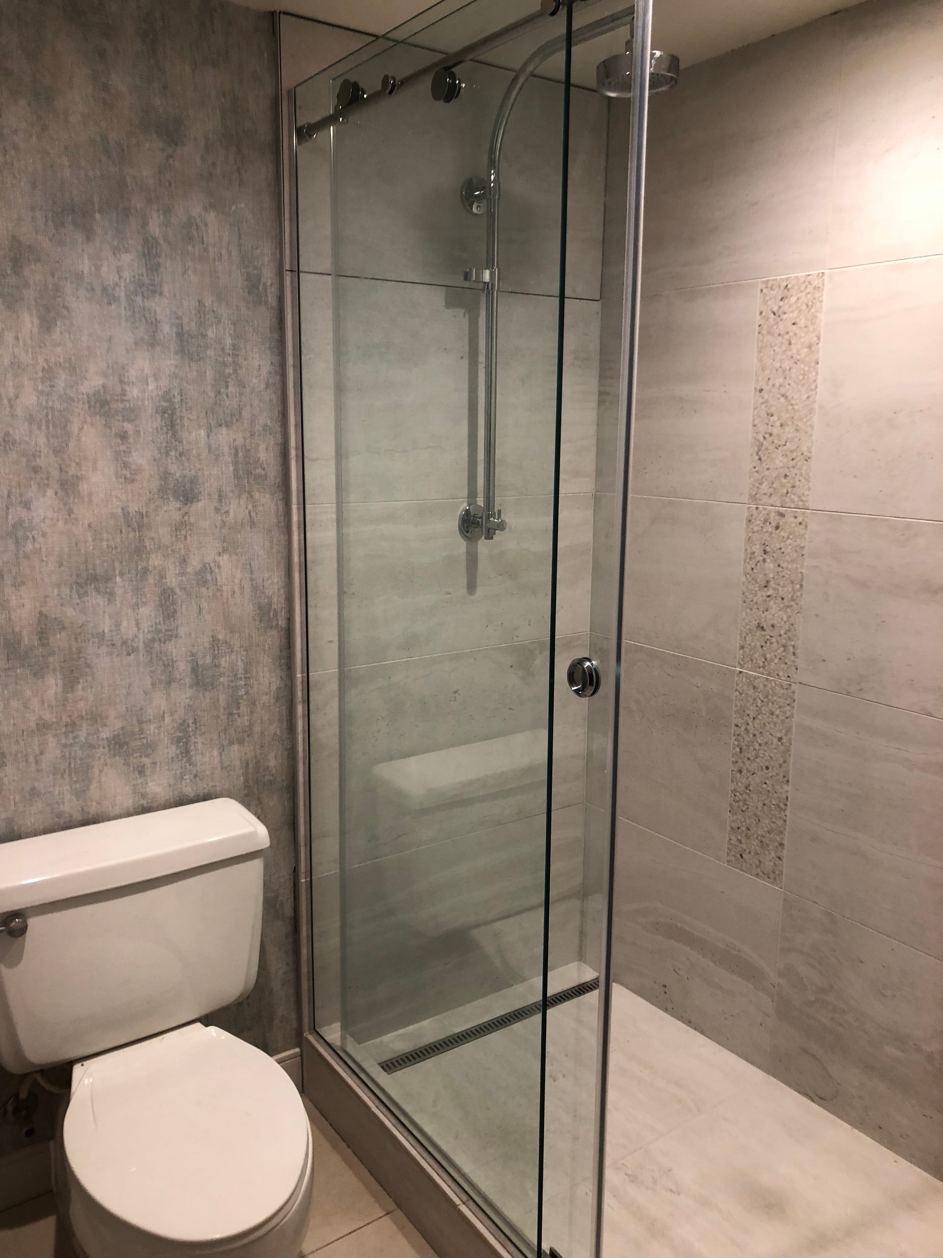 Renaissance Phoenix Downtown Hotel guest bathroom featuring large-format tile